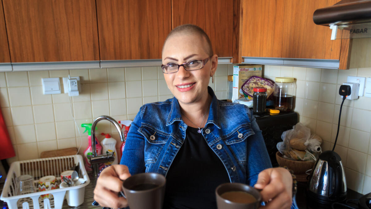 CT081016-NM-CANCER. Breast cancer survivor, Hana Abu at her residence in Dubai Sports City. Photo by Neeraj Murali.
