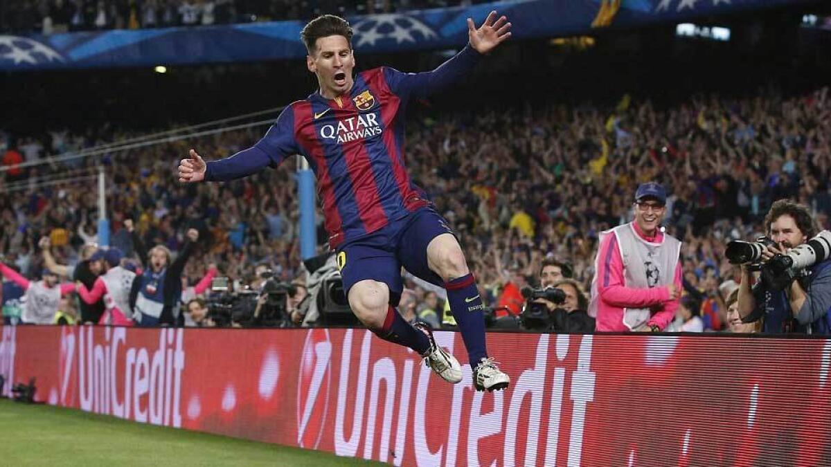 Messi flies through the air as he celebrates his goal against Bayern Munich at the Nou Camp as he helped Barca reach the final.