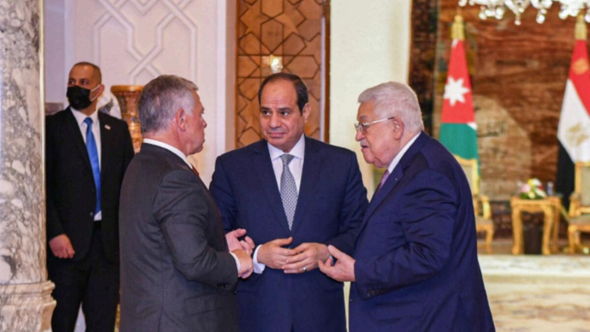 Mahmoud Abbas with Abdel Abdel Fattah Al Sisi and King Abdullah in Cairo during a trilateral summit. — AFP