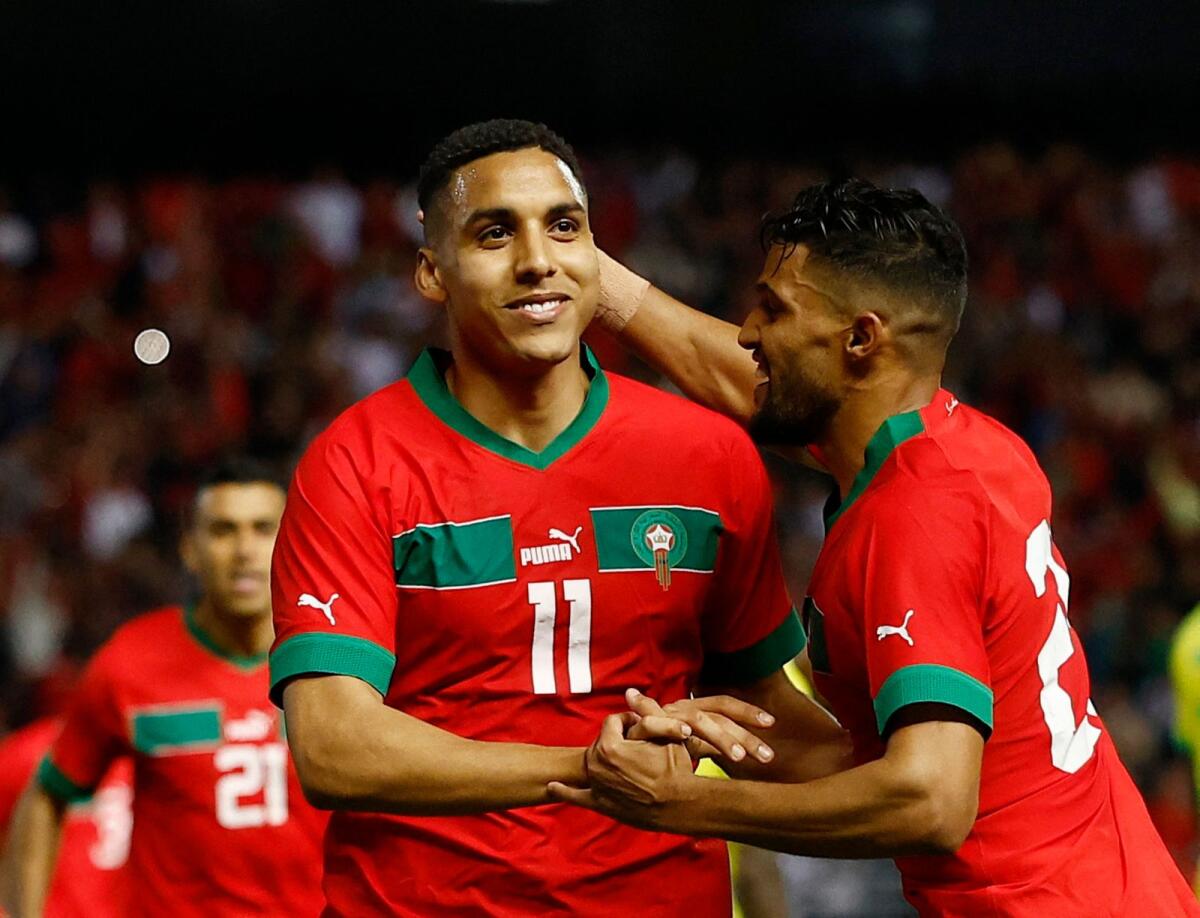 Morocco's Abdelhamid Sabiri celebrates scoring their second goal with teammates. — Reuters