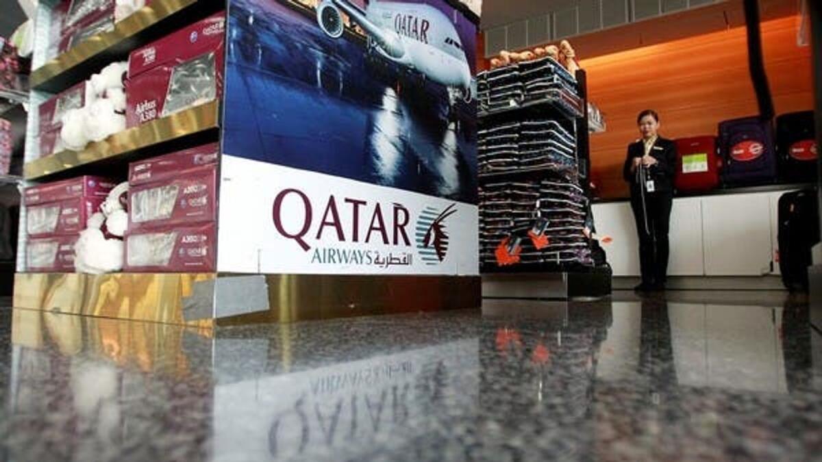 A sign of Qatar Airways is seen at Hamad International Airport in Doha, Qatar.