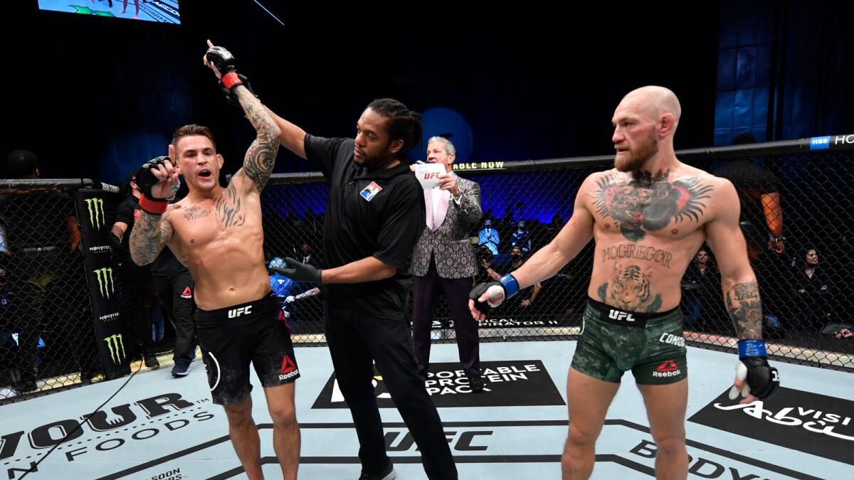 Dustin Poirier reacts after his knockout victory over Conor McGregor of Ireland in a lightweight fight during the UFC 257 event inside Etihad Arena on UFC Fight Island. — Reuters