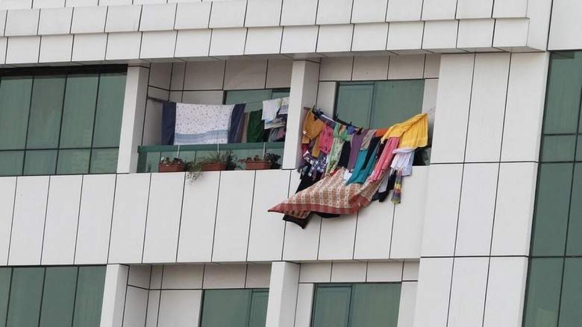 Heavy fines for hanging laundry in balcony in Kuwait