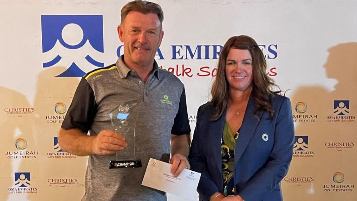 Russell Wilson (left), winner of the OMA Emirates Medal at Jumeirah Golf Estates with JGE Lady Captain Evelyn Downham. - Supplied photo