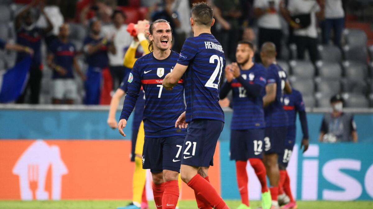 France's forward Antoine Griezmann (left) celebrates the win with Lucas Hernandez. (AFP)