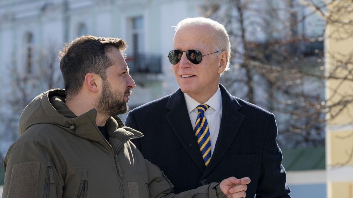 Joe Biden and  Volodymyr Zelensky talk during an unannounced visit in Kyiv. — AP