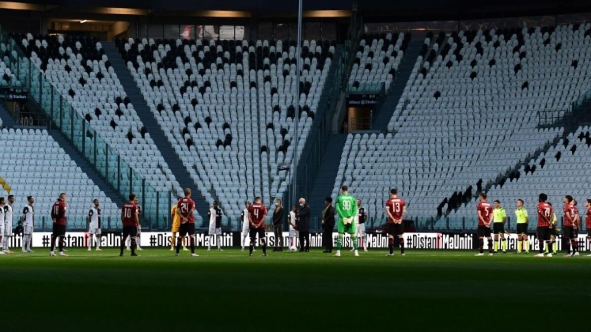 Players held a minute of silence for coronavirus victims prior to the Italian Cup semi-final second leg between Juventus vs AC Milan. - AFP