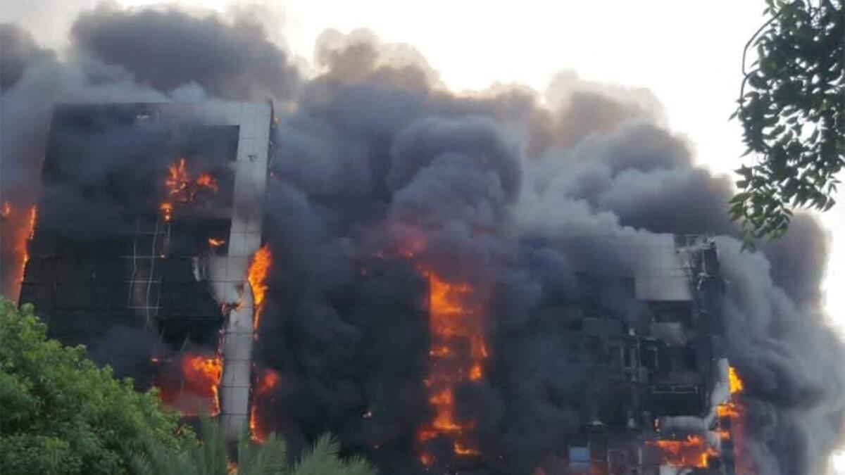 A raging fire at the Greater Nile Petroleum Oil Company Tower in Khartoum on Sunday. — AFP