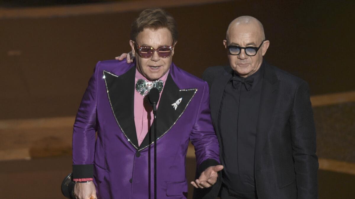 Just after performing his nominated song ‘(I’m Gonna) Love Me Again,’ Elton John and his songwriting partner Bernie Taupin took home an Oscar for best song.Taupin credited the win to ’53 years of hammering it out and doing what we do,’ while John thanked ‘everyone involved in Rocketman,’ the movie the song is featured in.