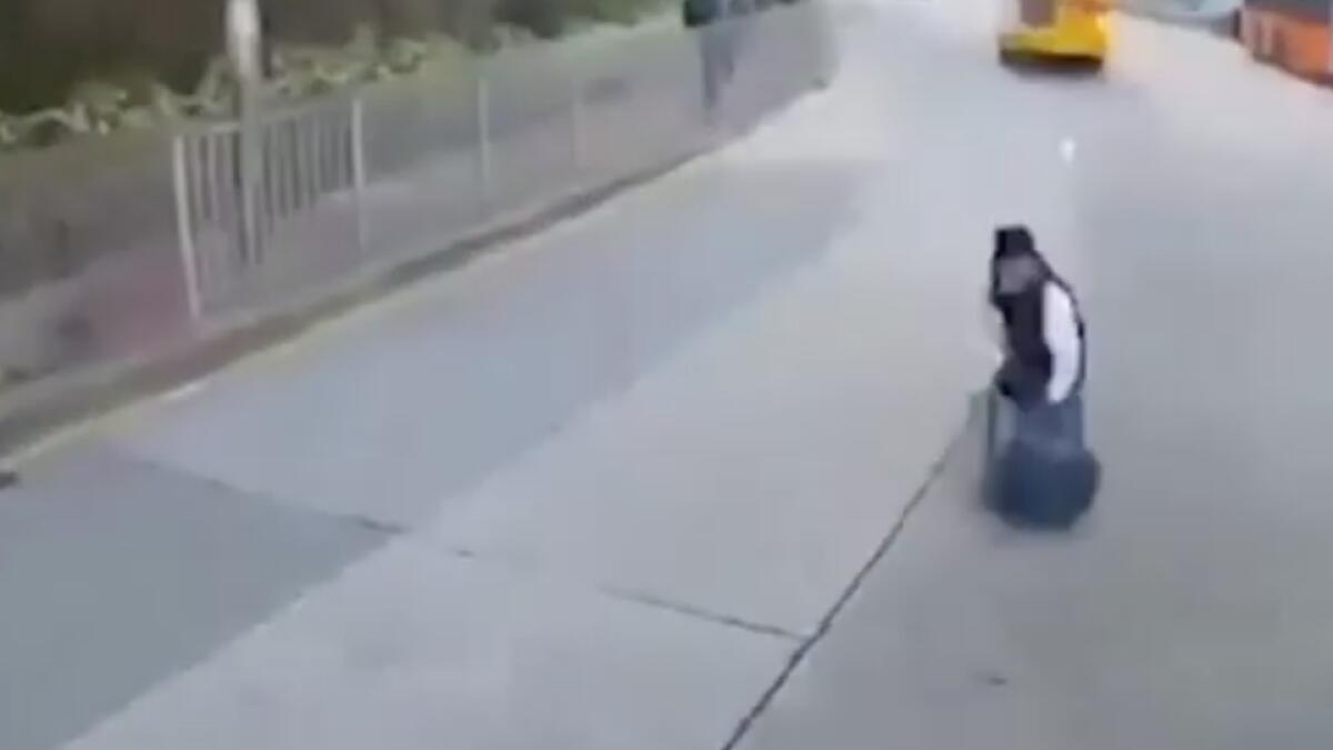 student falls off school bus, student falls on the road