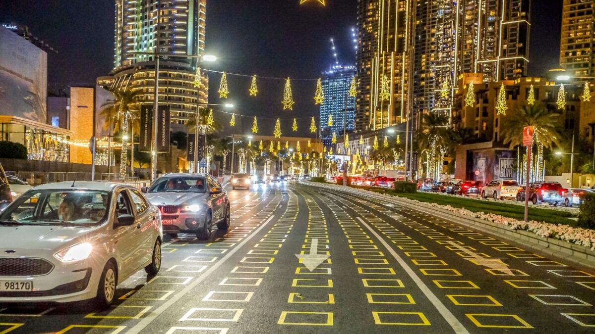 A road in Downtown Dubai features social distancing stickers that will help NYE revellers stay safe on December 31. — Photo by Shihab