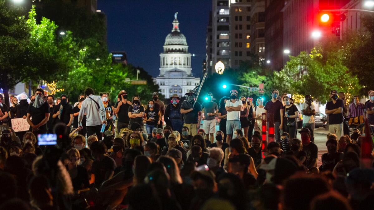 Hundreds of people gather for a vigil in memory of Garrett Foster, in Austin, Texas. Police have identified Foster as the armed protester who was shot and killed by a person who had driven into a crowd at a demonstration Saturday against police violence. Photo: AP