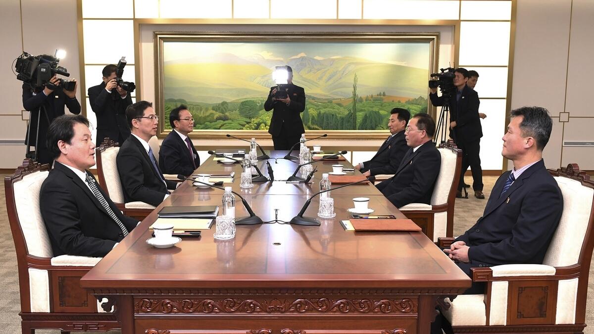 In this photo provided by South Korea Unification Ministry, South Korean Vice Unification Minister Chun Hae-sung, center left, talks with the head of North Korean delegation Jon Jong Su during their meeting.-AP