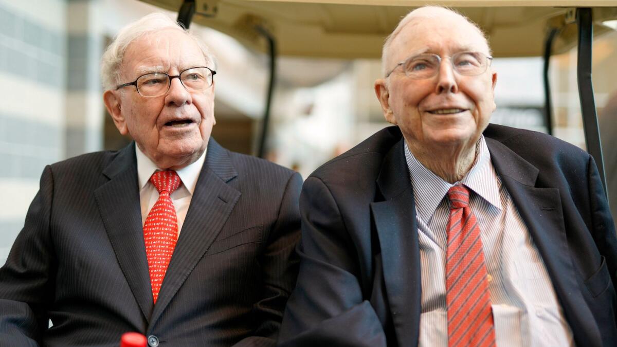 Berkshire Hathaway Chairman and CEO Warren Buffett, left, and Vice Chairman Charlie Munger. — AP file