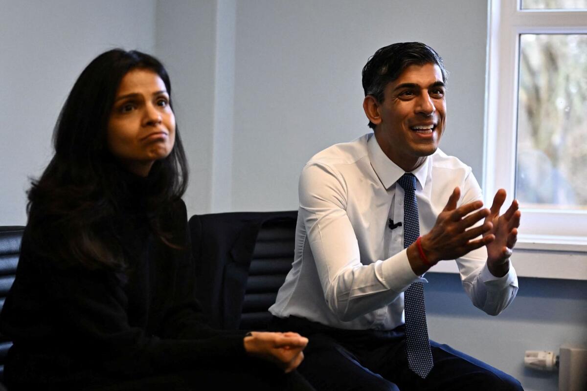 British Prime Minister Rishi Sunak (R) and his wife Akshata Murty attend a parenting workshop during a visit at a family hub in St Austell, Cornwall, South West of England, Britain. — Reuters file
