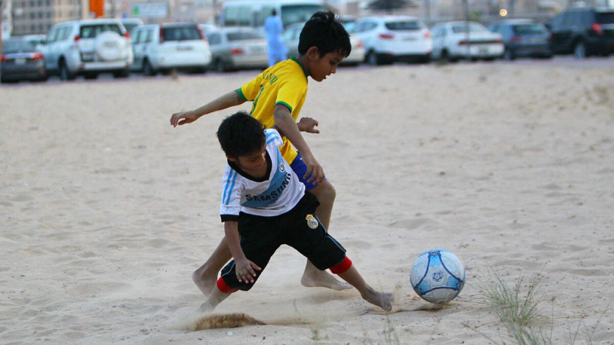 Kids enjoying a football game outside the Al Ras metro station in Dubai. -Photo by Neeraj Murali/ Khaleej Times