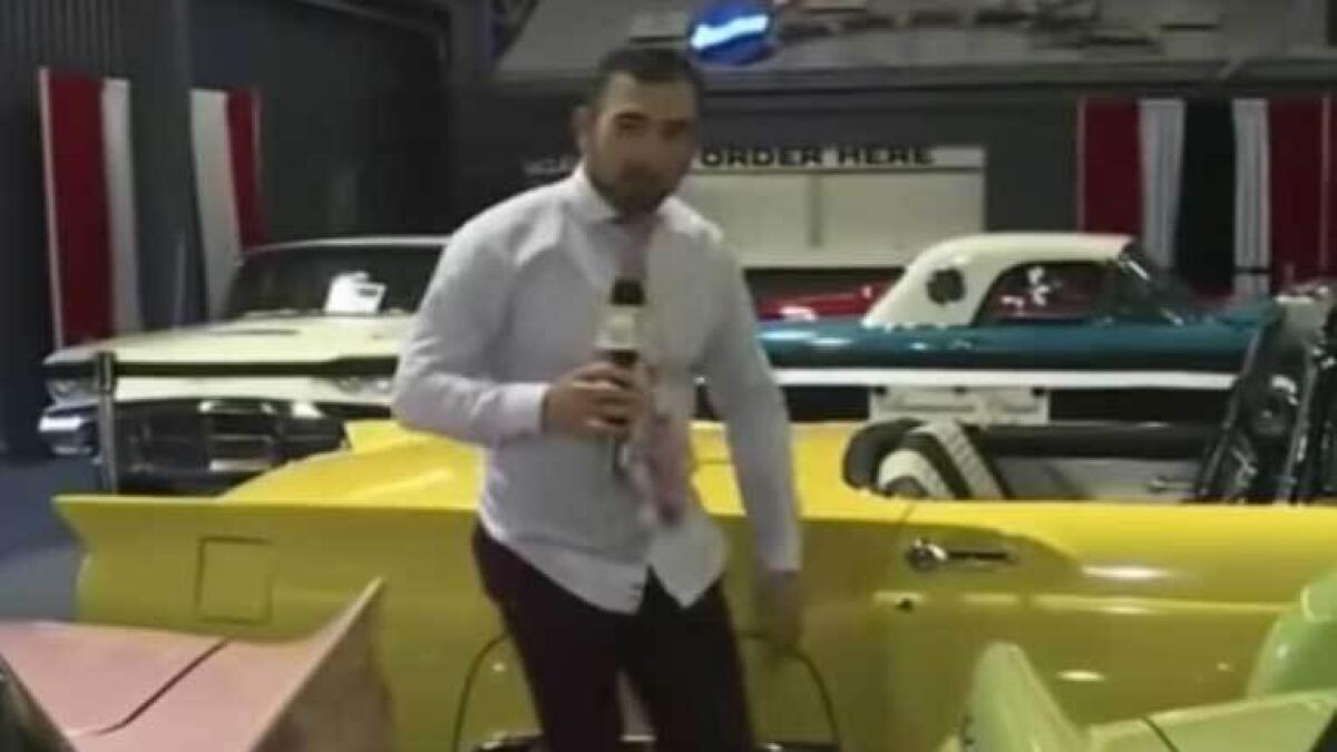 Reporter, fired, climbing, cars, auto show, vintage cars, 