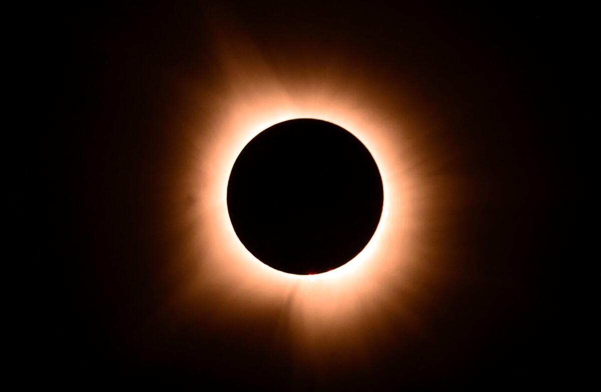 The moon eclipses the sun during a total solar eclipse across North America, in Bloomington, Indiana, on April 8, 2024. Photo: AFP