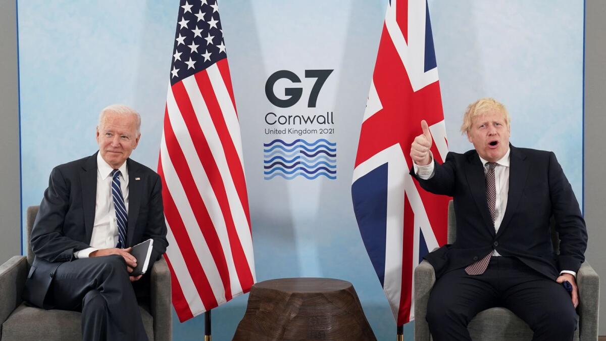 Britain's Prime Minister Boris Johnson gives a thumb up as US President Joe Biden looks on during their meeting, ahead of the G7 summit. Reuters