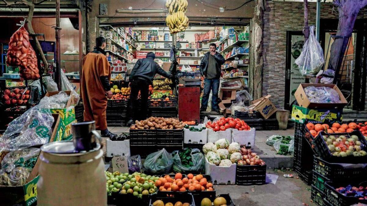 UNEASY CALM: A market scene in the rebel-held town of Douma, east of the Syrian capital Damascus.  President Assad may have the upperhand for now, but real peace remains elusive in the country. 