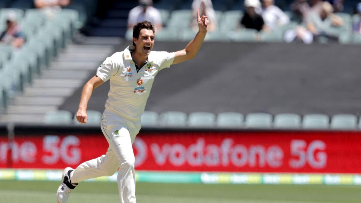 Pat Cummins celebrates a dismissal during the first Test against India in Adelaide. — ANI