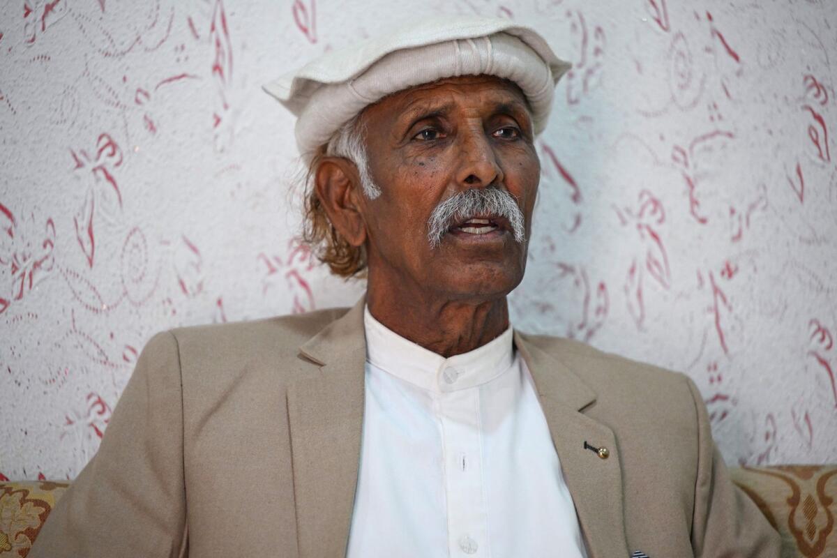 Malik Muhammad, a member of the village council, speaks during an interview in Dhurnal of Punjab province, ahead of the upcoming general elections. — AFP