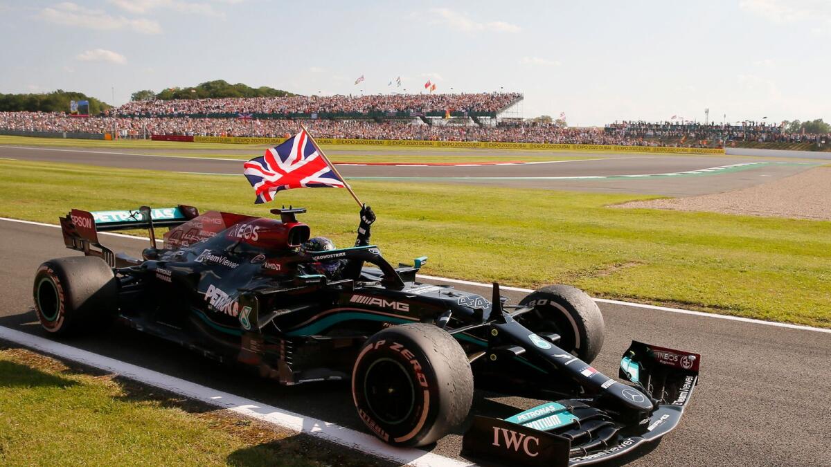 Mercedes' Lewis Hamilton celebrates after winning the British Grand Prix. — Reuters