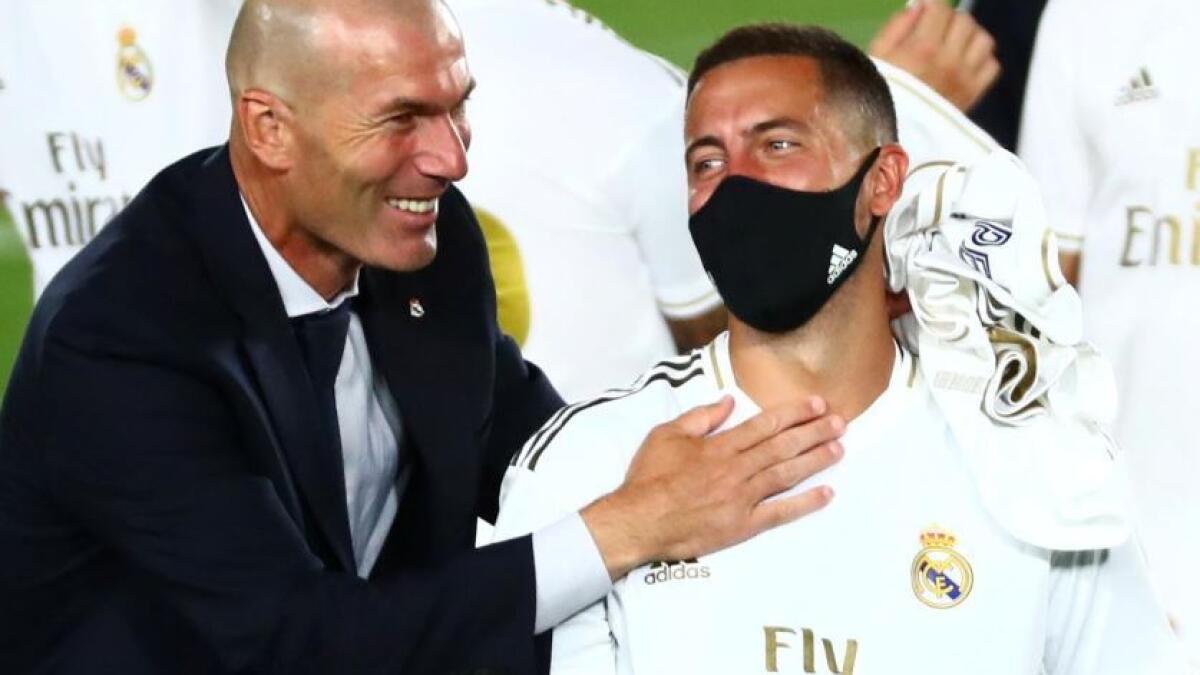 Real Madrid's Eden Hazard and coach Zinedine Zidane celebrate after winning the La Liga title. (Reuters)