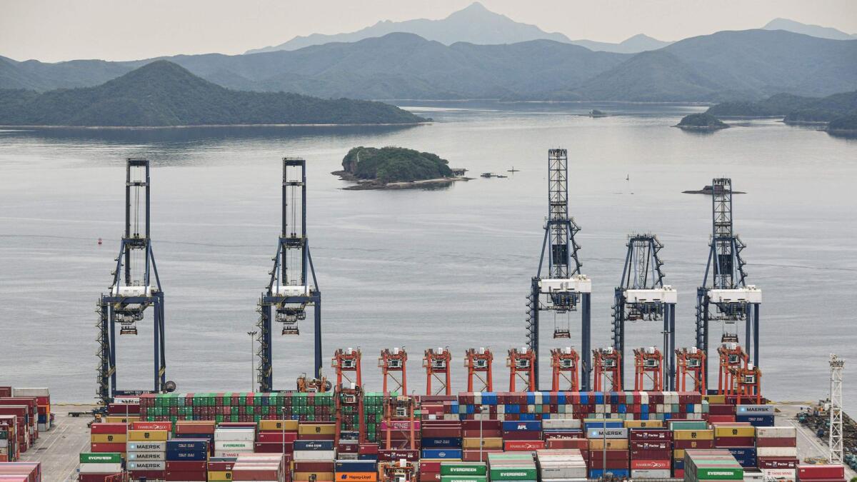 Cargo containers stacked at Yantian port in Shenzhen in China's southern Guangdong province. Exports rose 18 per cent in July from a year earlier, the fastest pace this year, official customs data showed on Sunday. — AFP file photo