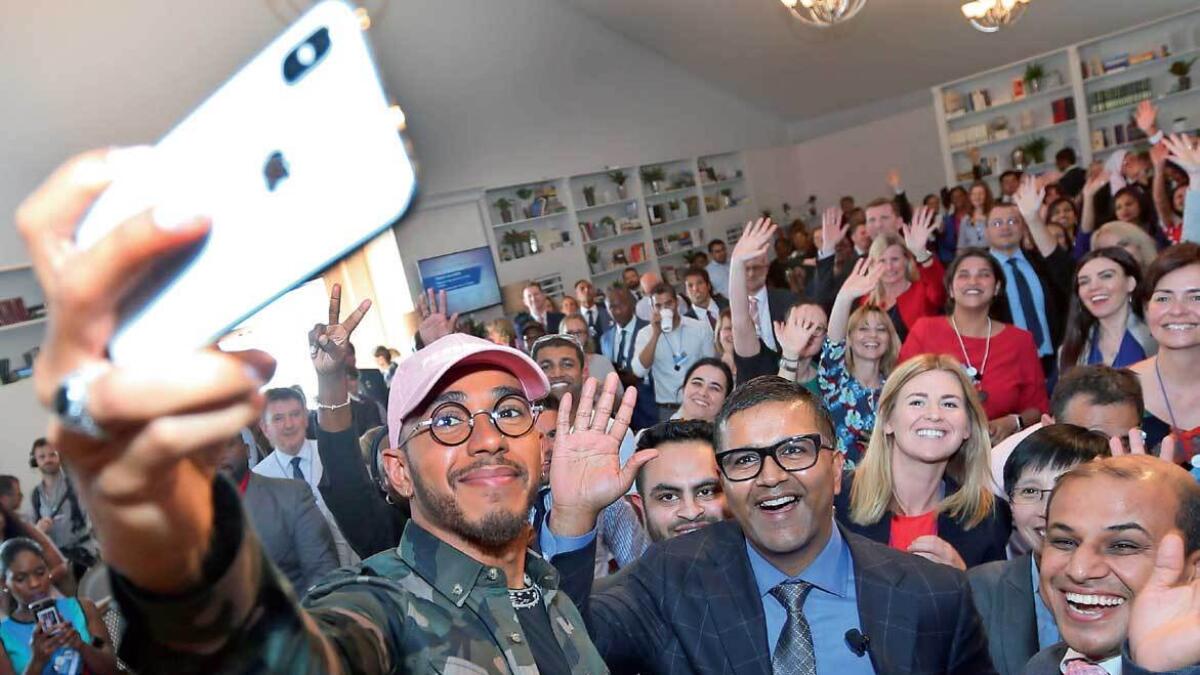 Lewis Hamilton poses for a selfie with the participants of the Global Education and Skills Forum in Dubai.-Photos by Dhes Handumon 