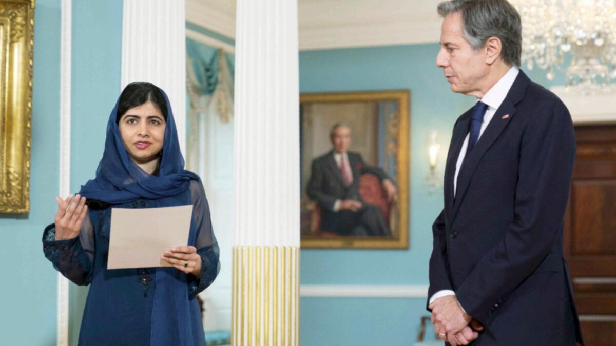 Malala Yousafzai with Secretary of State Antony Blinken in Washington. — AFP