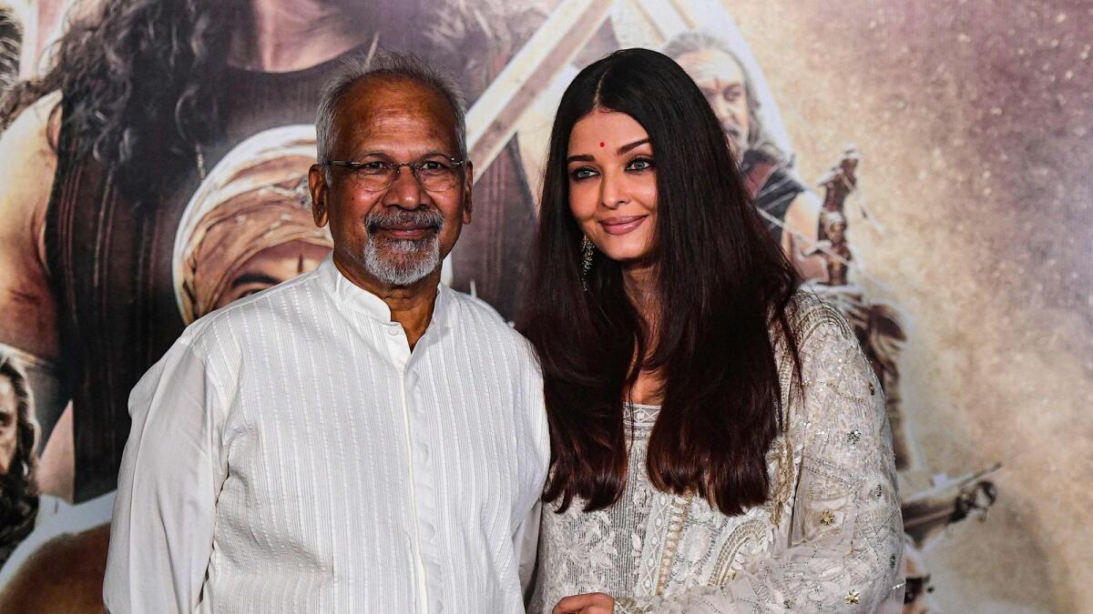 Indian film director, screenwriter, and producer Mani Ratnam with Aishwarya Rai Bachchan at a press conference for Ponniyin Selvan: I in Mumbai on September 24