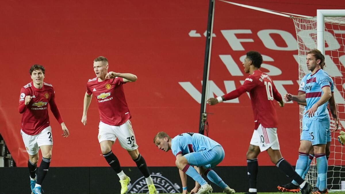 Manchester United's players celebrate during the English Premier League match against West Ham United at Old Trafford. — AP
