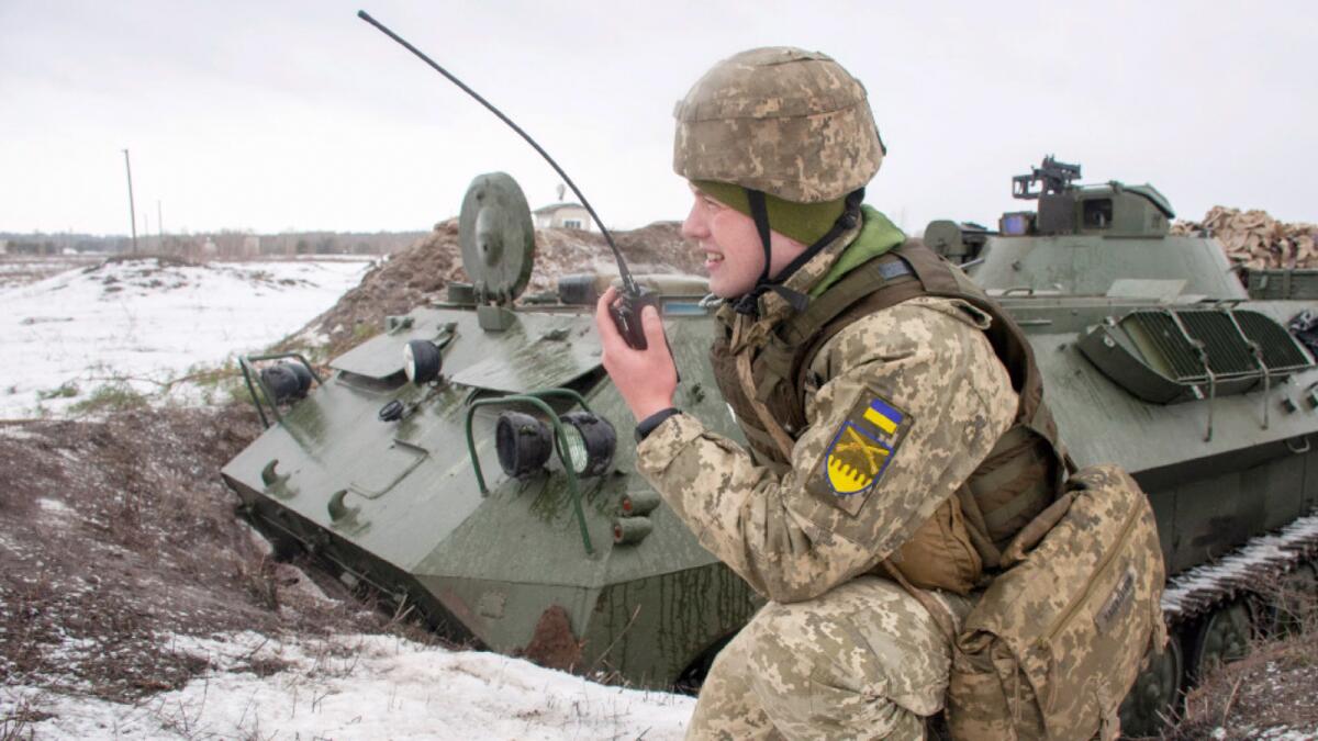A Ukrainian soldier trains during military drills close to Kharkiv, Ukraine. — AP