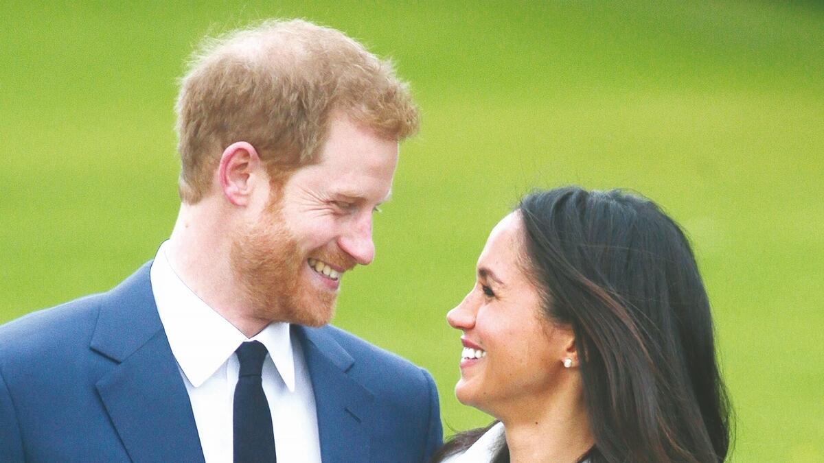 Britains Prince Harry and his fiancé US actress Meghan Markle.- AFP