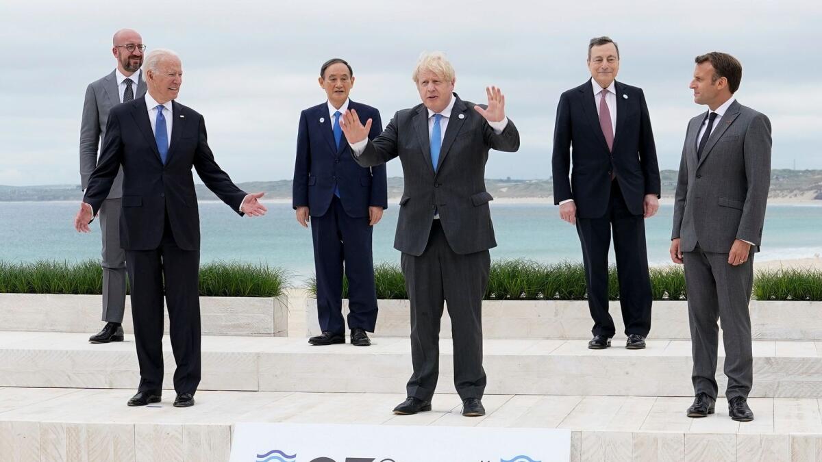 G7 leaders posing for a family photo in Carbis Bay, Cornwall.