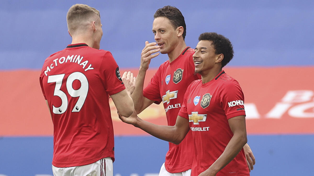 Manchester United's Jesse Lingard (right) is confident the team can capture the title for a second time. -- AFP