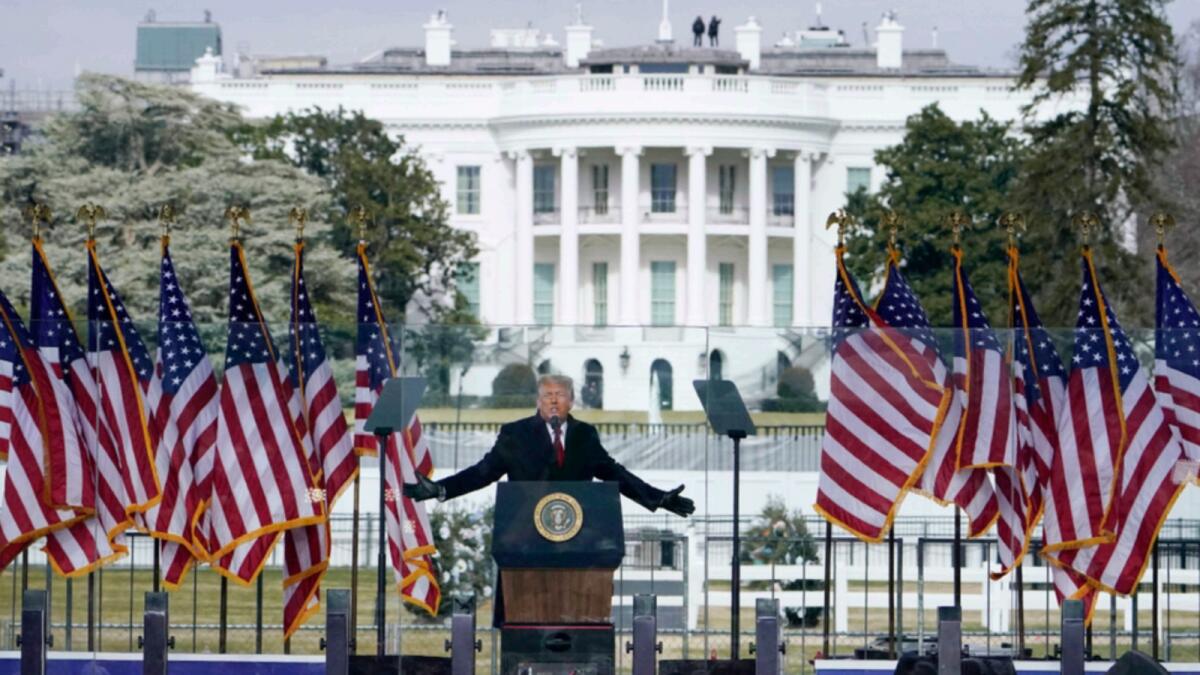 The White House in the background, President Donald Trump speaks at a rally in Washington, Jan. 6, 2021. — AP file