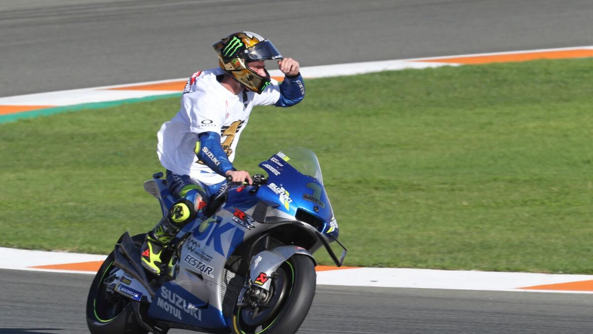 Spain's rider Joan Mir of the Team SUZUKI ECSTAR celebrates at the end of the MotoGP race during Valencia Grand Prix. — AP