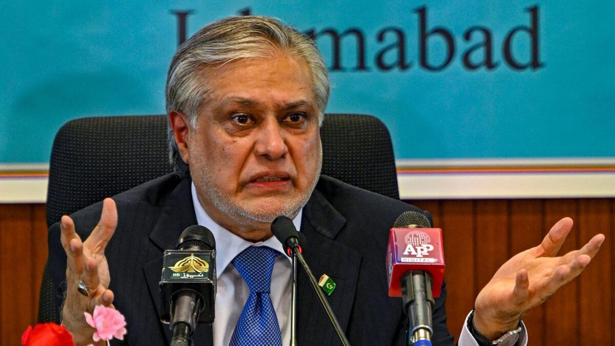 Pakistan's finance minister Ishaq Dar speaks while presenting the economic report for fiscal year 2022-23. — AFP
