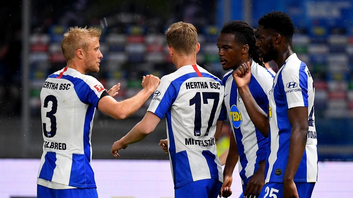 Hertha Berlin's Dedryck Boyata (second right) and his teammates celebrate the 4-0 win over FC Union Berlin (AFP)