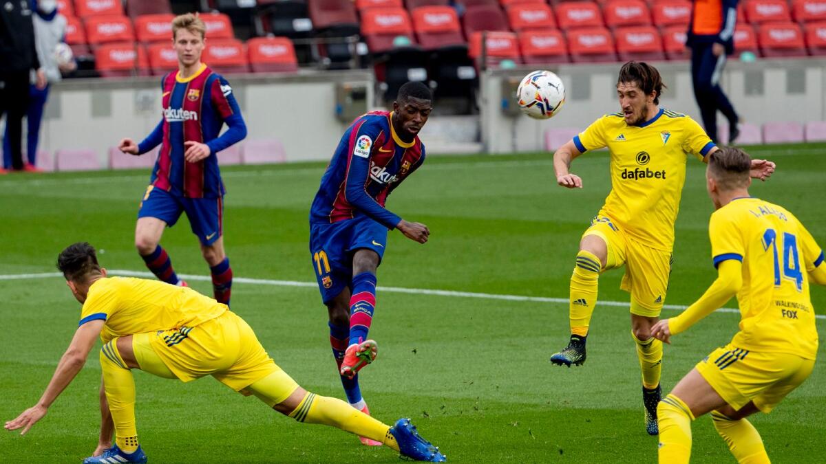 Barcelona’s Ousmane Dembele kicks the ball during the Spanish La Liga match against Cadiz at the Camp Nou. — AP