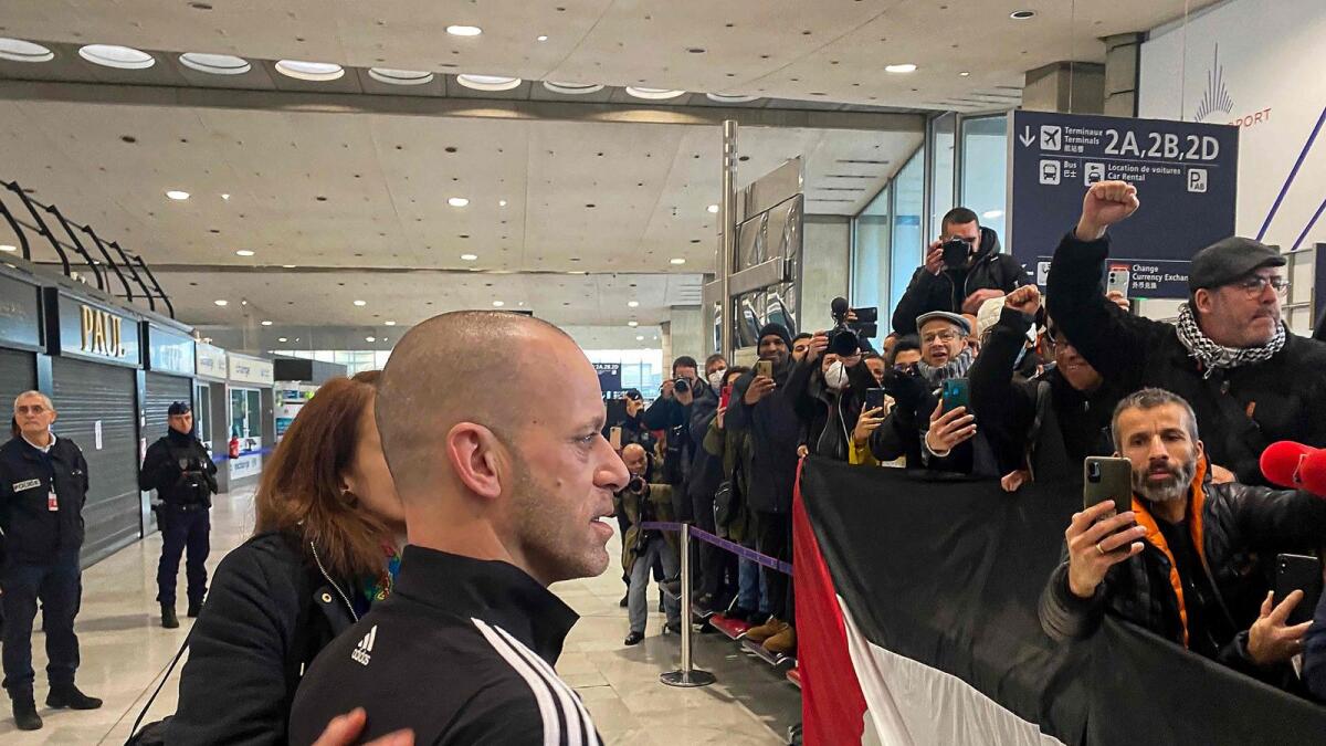 French-Palestinian lawyer Salah Hamouri (C) arrives at the Parisian airport of Roissy, after he was expelled from Israel, on December 18, 2022. — AFP