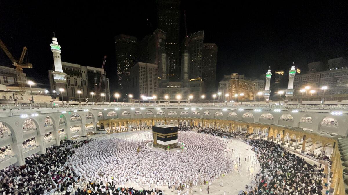 Muslim pilgrims circle the Kaaba and pray at the Grand Mosque as Saudi Arabia welcomes back pilgrims for the 2022 haj season. Photo: Reuters