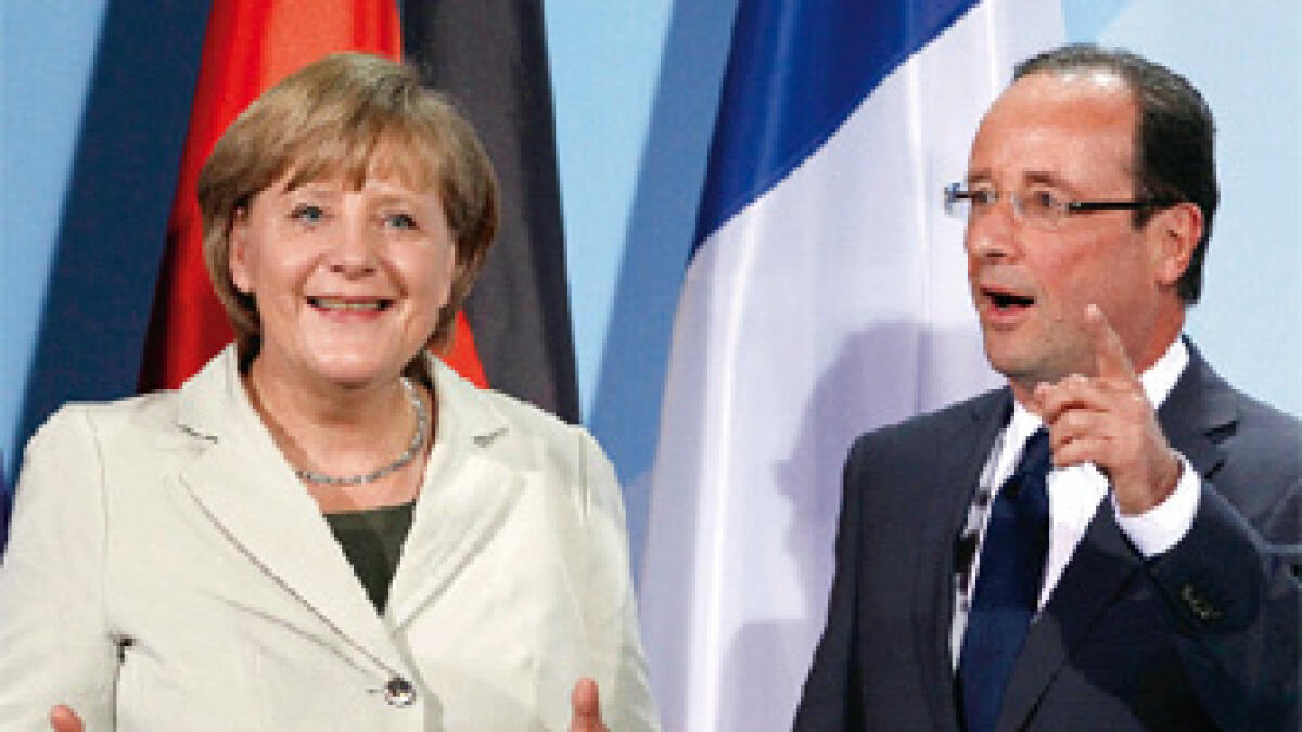 Merkel, Hollande differ sharply going into EU summit