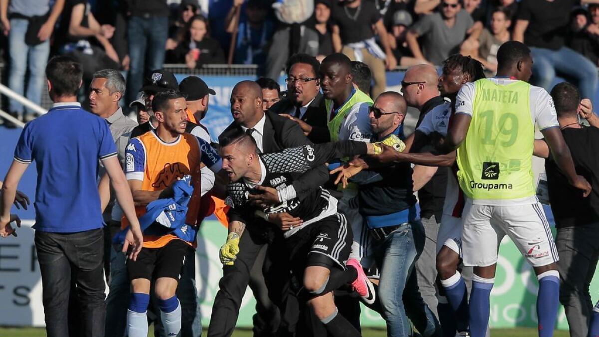 Football: French match ends at halftime after fans attack Lyon players