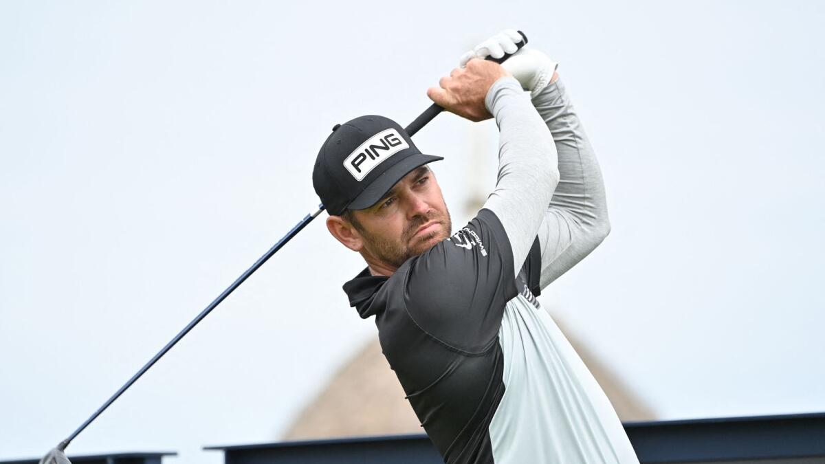 South Africa's Louis Oosthuizen watches his drive from the 17th tee during the first round of the British Open at Royal St George's, Sandwich, on Thursday. (AFP)