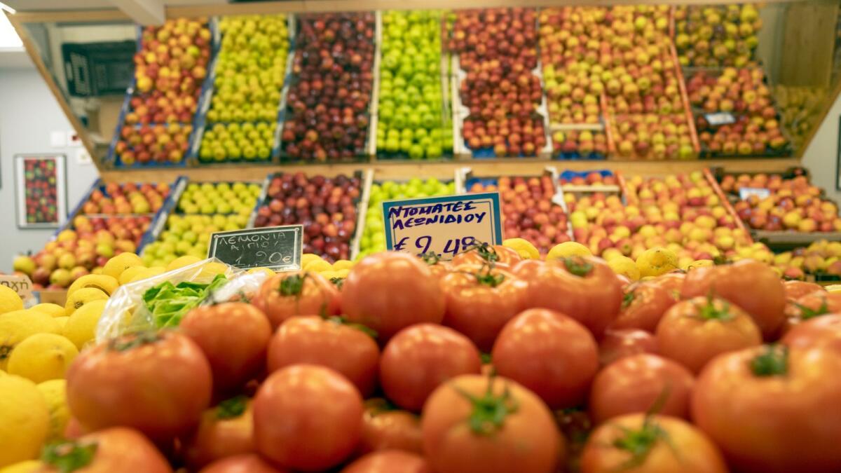 A grocery store in Athens, Greece. The European Central Bank raised a key interest rate to a record high last week. — AP