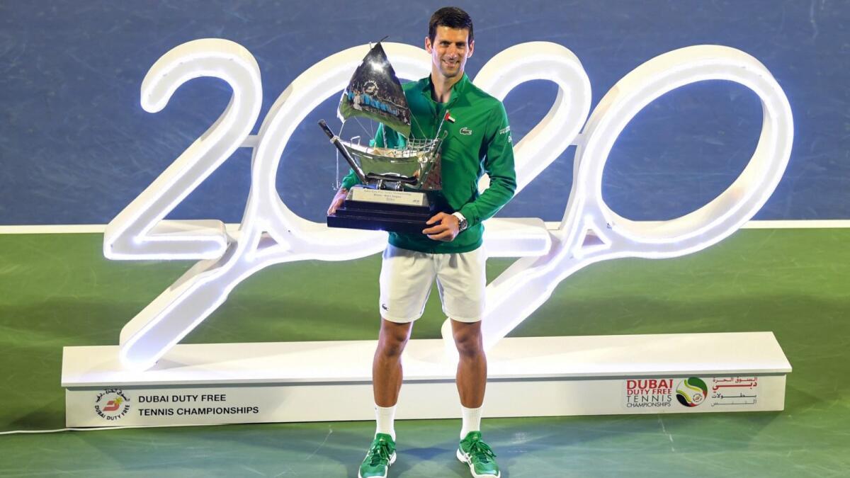 Novak Djokovic poses with the trophy after winning the Dubai Duty Free Tennis Championships in 2020. (AFP file)