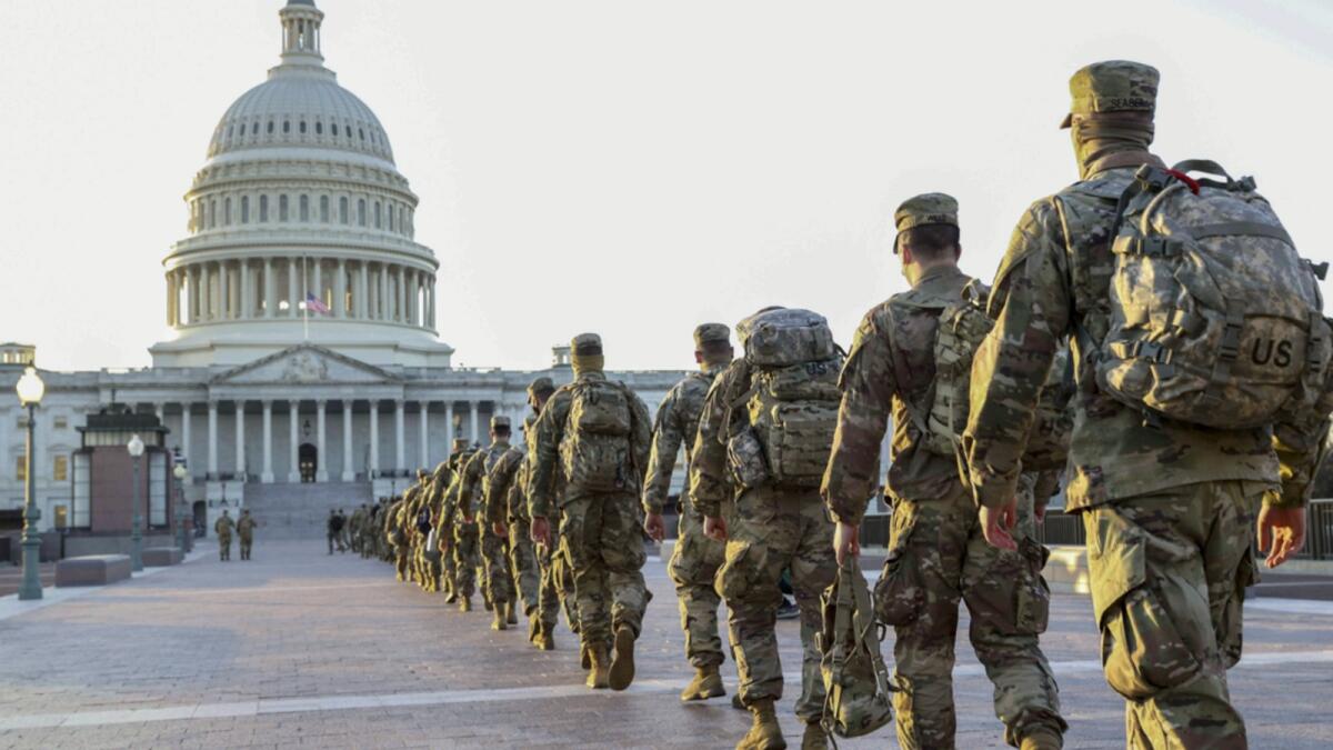 Members of the US National Guard arrive at the US Capitol. The Pentagon is deploying as many as 15,000 National Guard troops to protect President-elect Joe Biden's inauguration on January 20, amid fears of new violence. — AFP